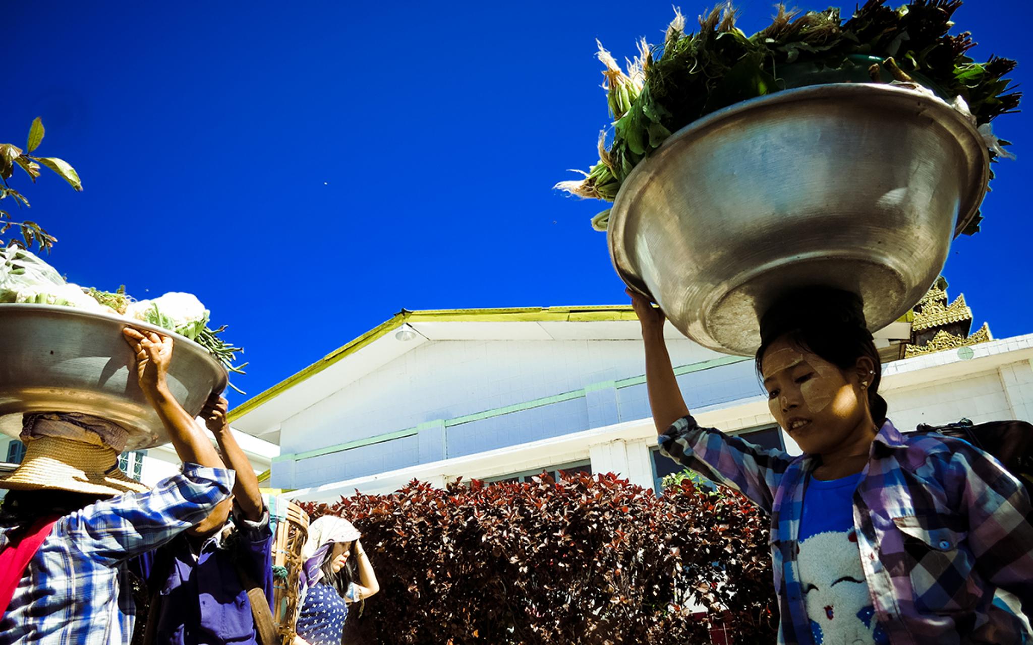 Lady carrying bowl on head MRC