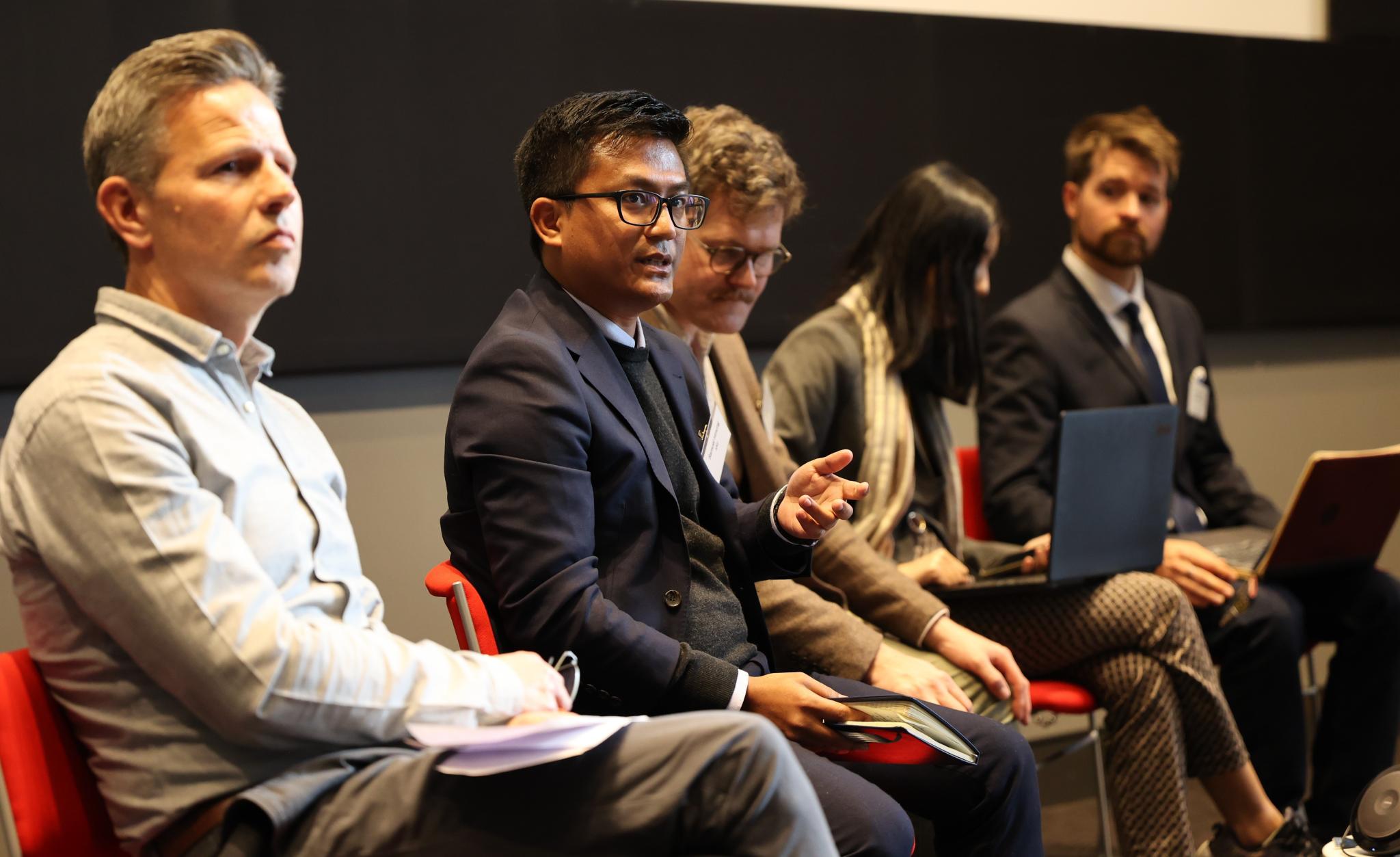  PhD scholar Samuel Hmung speaking on a panel discussion at the 2023 Myanmar Update conference. 